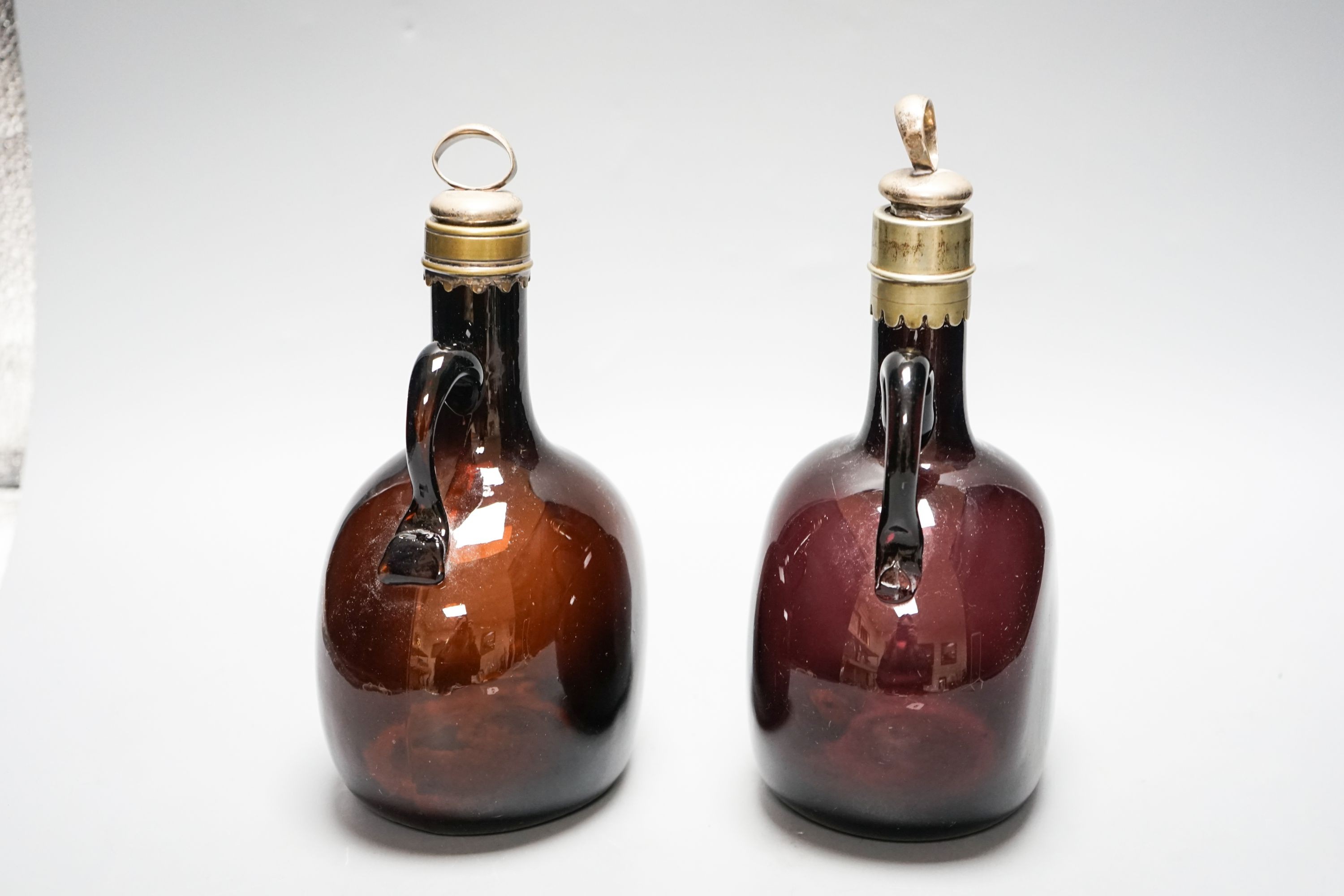 A Victorian amethyst glass claret and amber hock jugs, 23cm